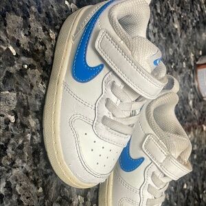 Nike White and Blue Sneakers with Classic Design